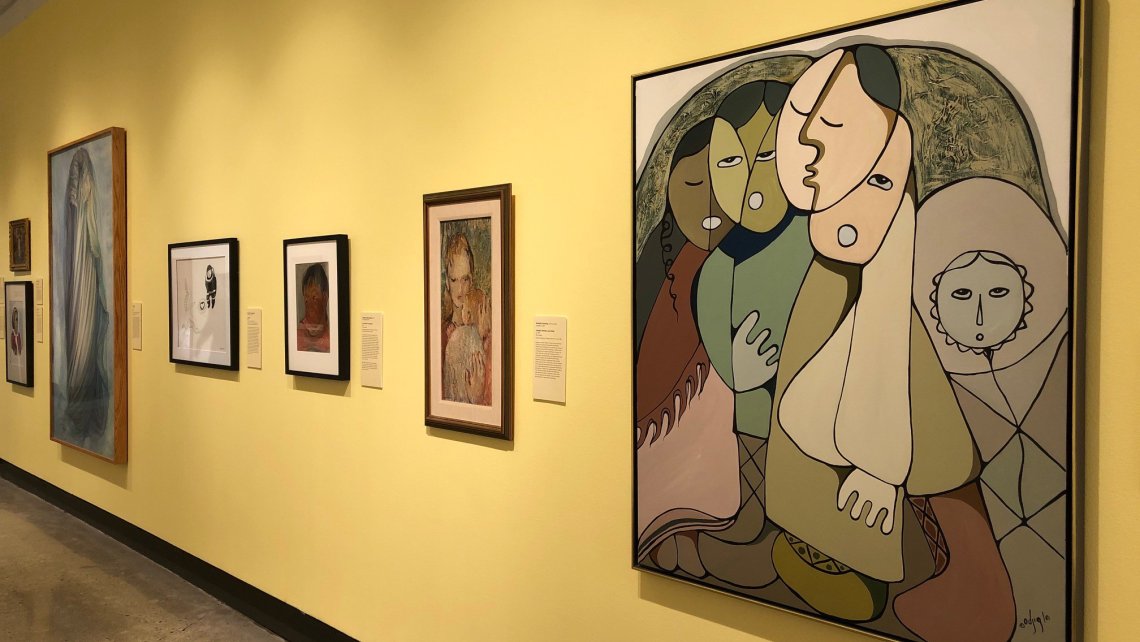 Installation showing framed works of various sizes