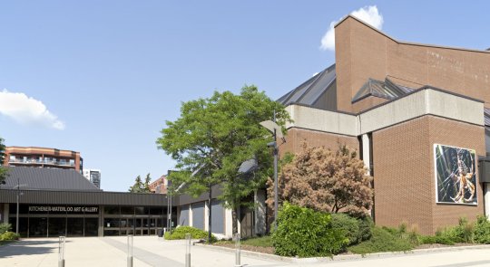 Exterior view of KWAG at Centre In The Square with Terre Chartrand's Asibikaashi on view on an exterior wall to the right